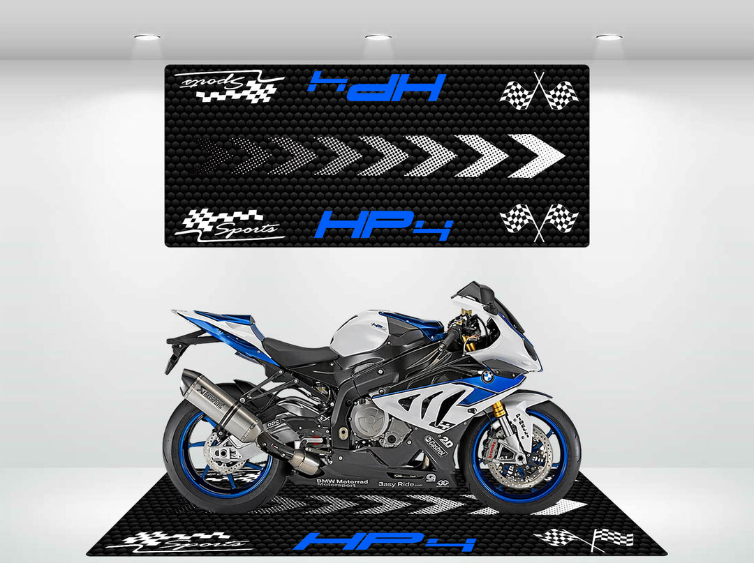 A sporty blue and white motorcycle rests on a stylish Motorcycle Pit Mat for 1000RR HP4 with racing flag patterns. Bright lighting accentuates the bikes sleek design, enhancing its dynamic presence.