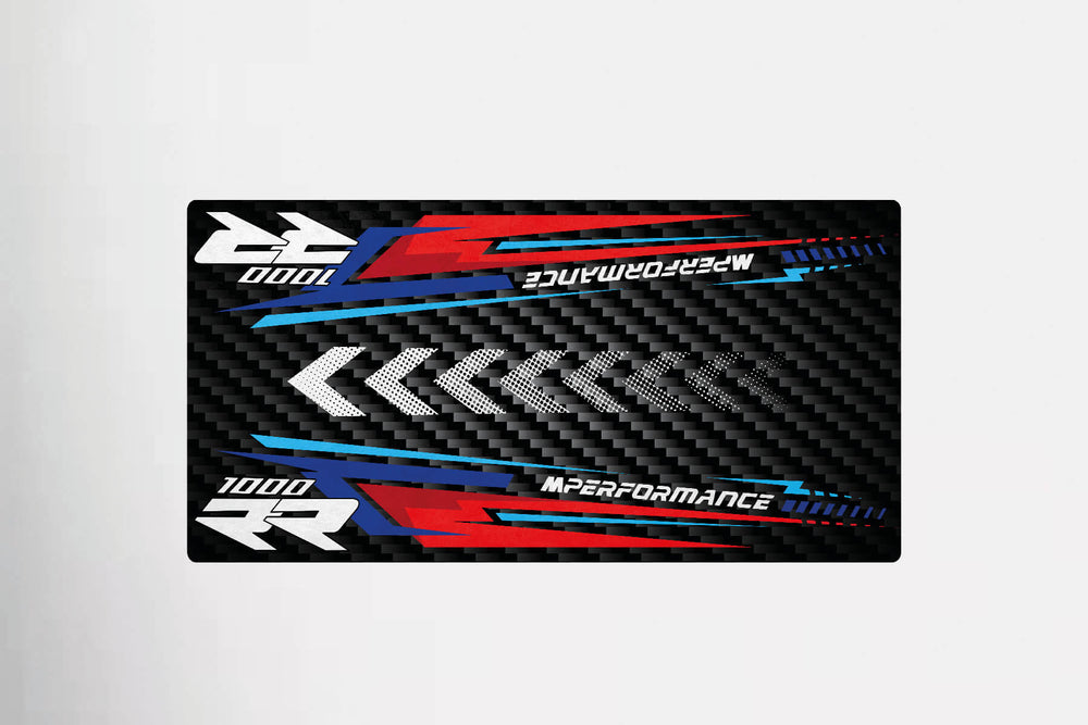 Rectangular racing graphic floor mat featuring white, red, and blue stripes with arrows on a black carbon fiber background. It reads 1000 RR and M Performance. Perfect for the M1000RR by Motorcycle Pit Mat.