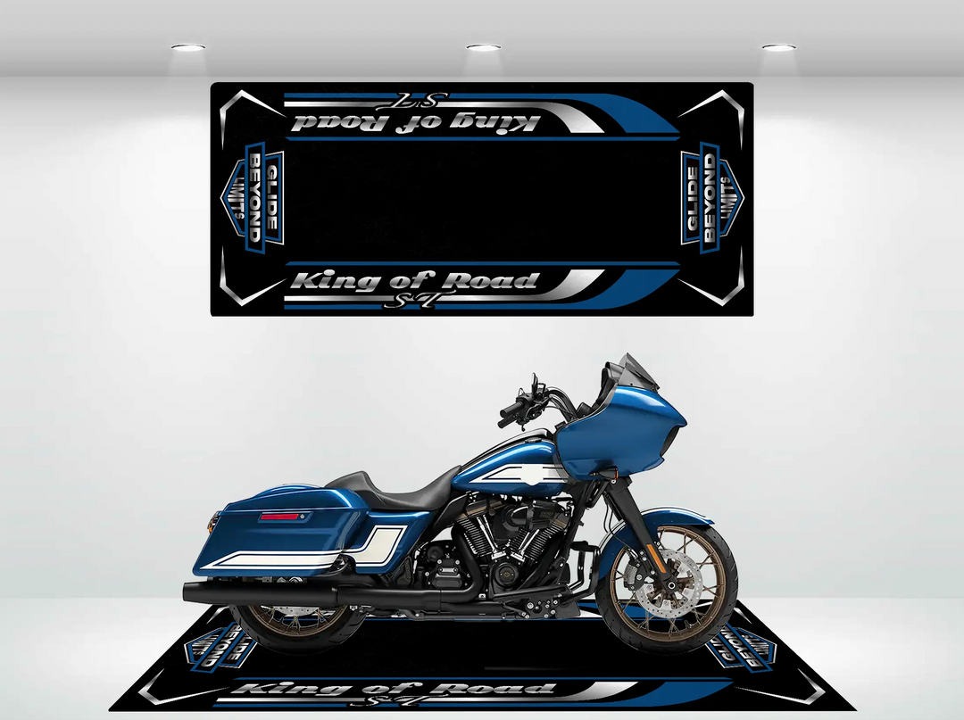 A blue touring motorcycle is displayed in a showroom with custom black and blue Motorcycle Pit Mat, enhancing the Road Glide ST design. Its sleek design, large front fairing, and side panniers showcase unmatched durability for any journey.