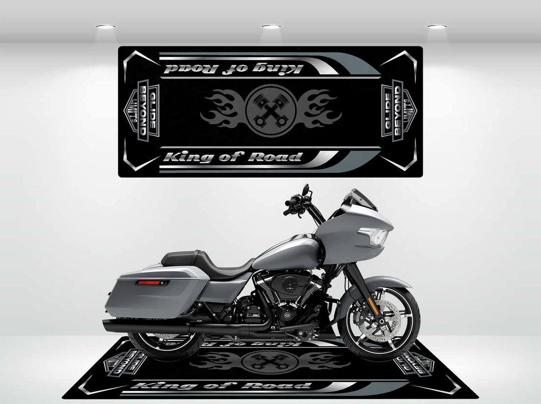 In the showroom, a sleek Harley Davidson rests on a durable Motorcycle Pit Mats Motorcycle Mat for Road Glide, surrounded by wall hangings with emblem designs. The well-lit space beautifully highlights the bikes modern and sleek design.