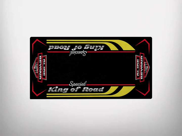 The Motorcycle Pit Mat offers a nostalgic vibe with the King of Road Special design, featuring white cursive lettering, yellow curved stripes, and red geometric accents on a black background—evoking the vintage spirit of a Harley Davidson ride.