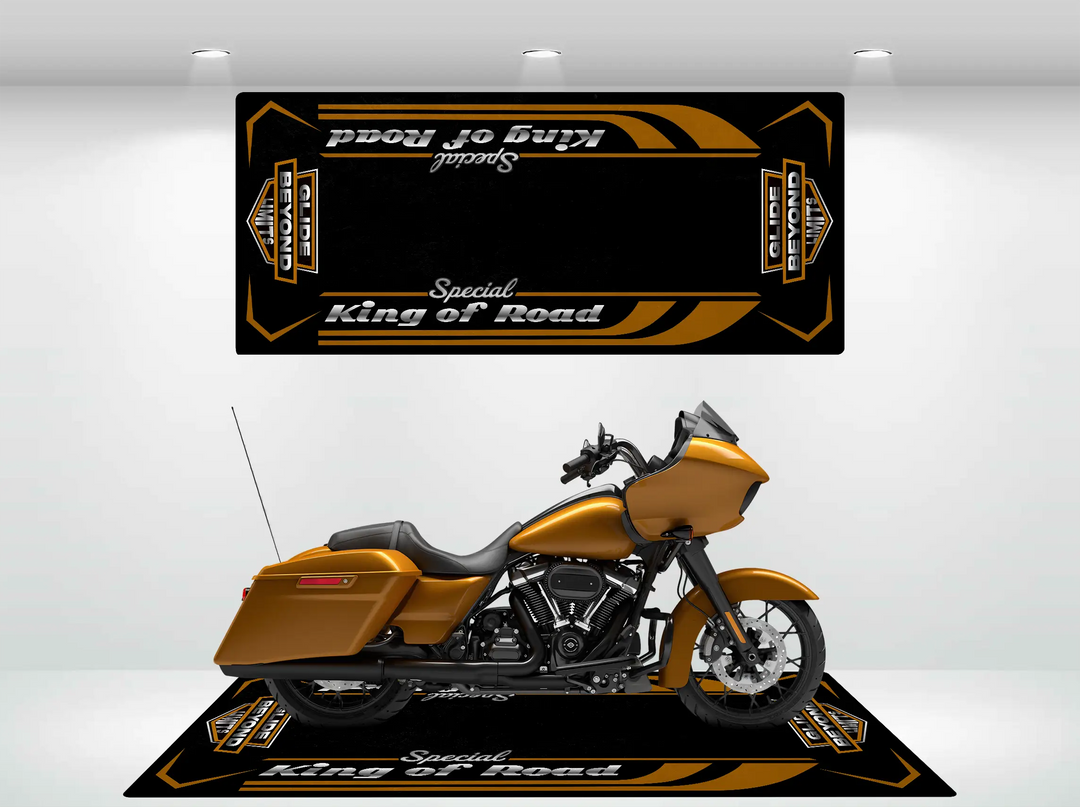 A gold Harley Davidson motorcycle is showcased on a Motorcycle Pit Mats Road Glide Special mat, featuring matching graphics and text. Above it, a rectangular backdrop with similar design elements creates a cohesive, garage-style exhibit.