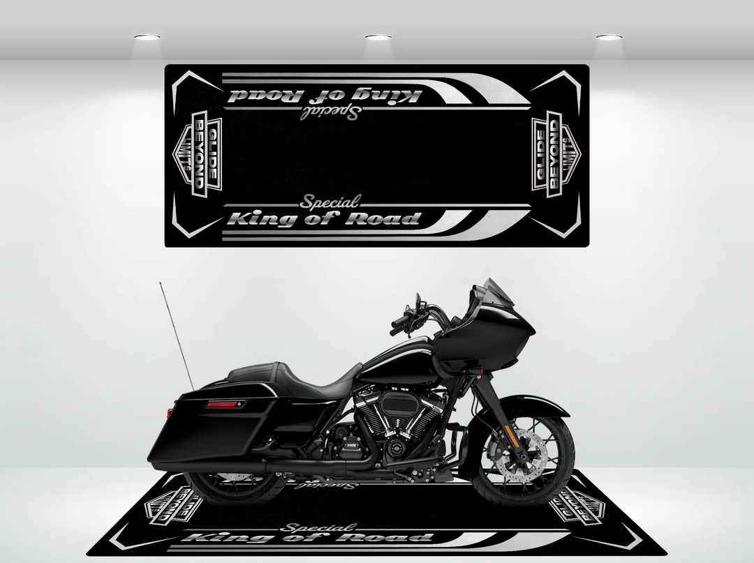 A black Harley Davidson on a Motorcycle Pit Mat for Road Glide Special is parked on a stylized display with matching wall art, both featuring geometric designs and Special King of Road in white. The setup is in a well-lit room.