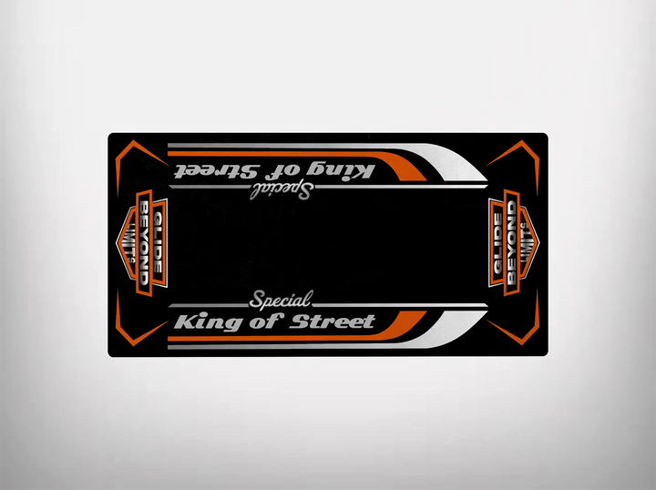 The Motorcycle Pit Mat, King of Street Special, features a black rectangular design with orange and white accents, reminiscent of a Harley Davidson. King of Street boldly appears in the center, flanked by Globe Demo logos and dynamic arrows on a white backdrop.