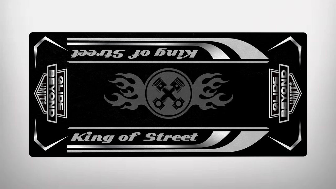 The Motorcycle Pit Mat for King of Street features King of Street and Glide Beyond Limit text, stylized flaming pistons, a symmetrical Harley Davidson-inspired design, and bold borders on a dark backdrop for durability.