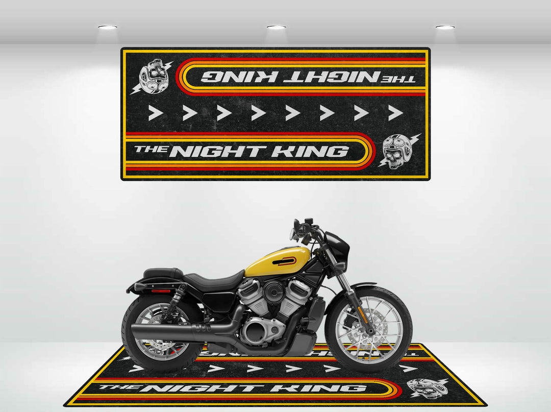 A black and yellow motorcycle is showcased in a well-lit showroom with two matching Motorcycle Pit Mats, featuring the text The Night King plus helmet and arrow graphics, enhancing a coordinated theme.