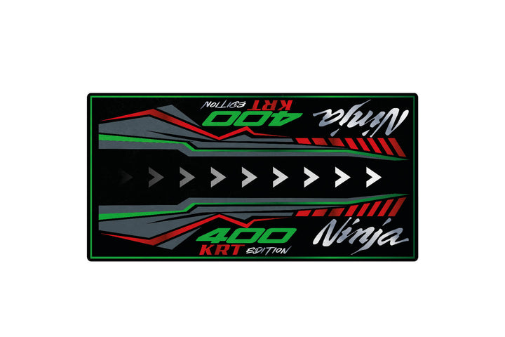 The Motorcycle Pit Mat for Kawasaki Ninja 400 KRT Edition showcases bold Ninja and 400 KRT EDITION text with arrows and geometric shapes in black, green, red, and gray on a sleek motorcycle mat.