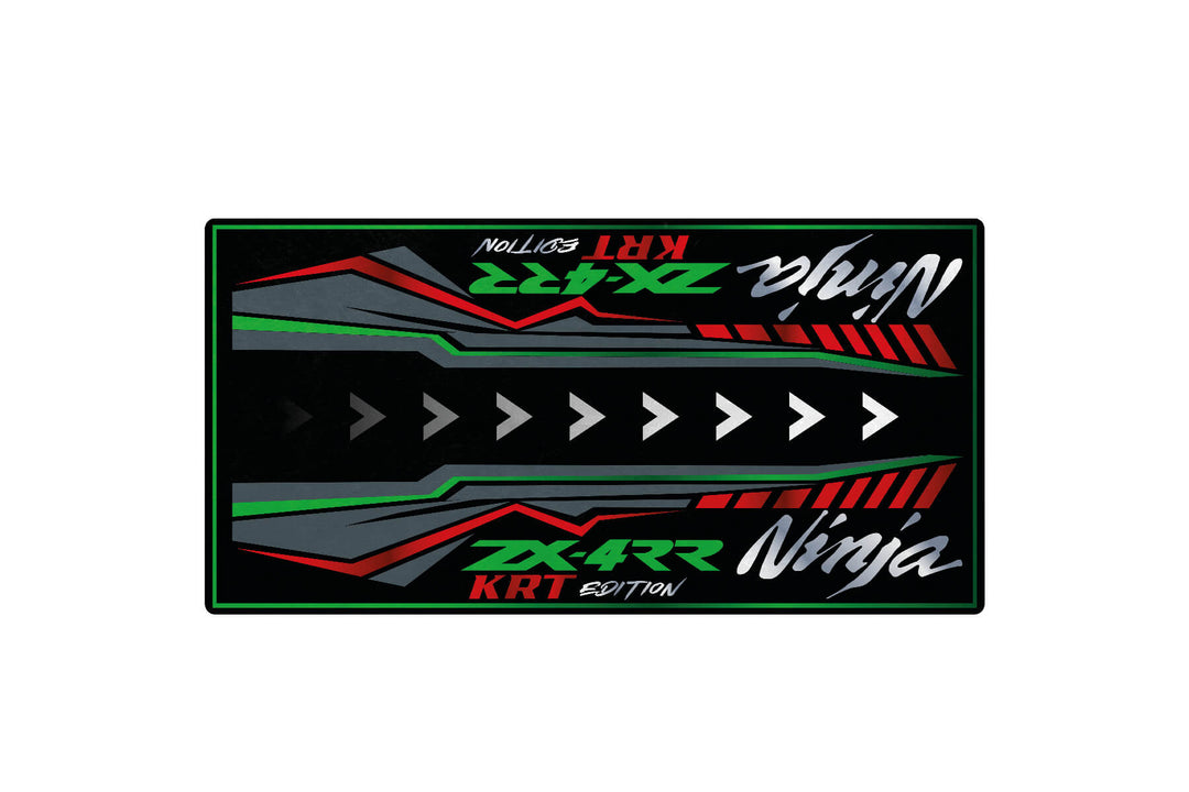 The Motorcycle Mat for Kawasaki Ninja ZX-4RR KRT Edition showcases ZX-4RR, KRT Edition, and Ninja alongside bold arrows and angular designs in green, red, white, and gray on a sleek black mat.