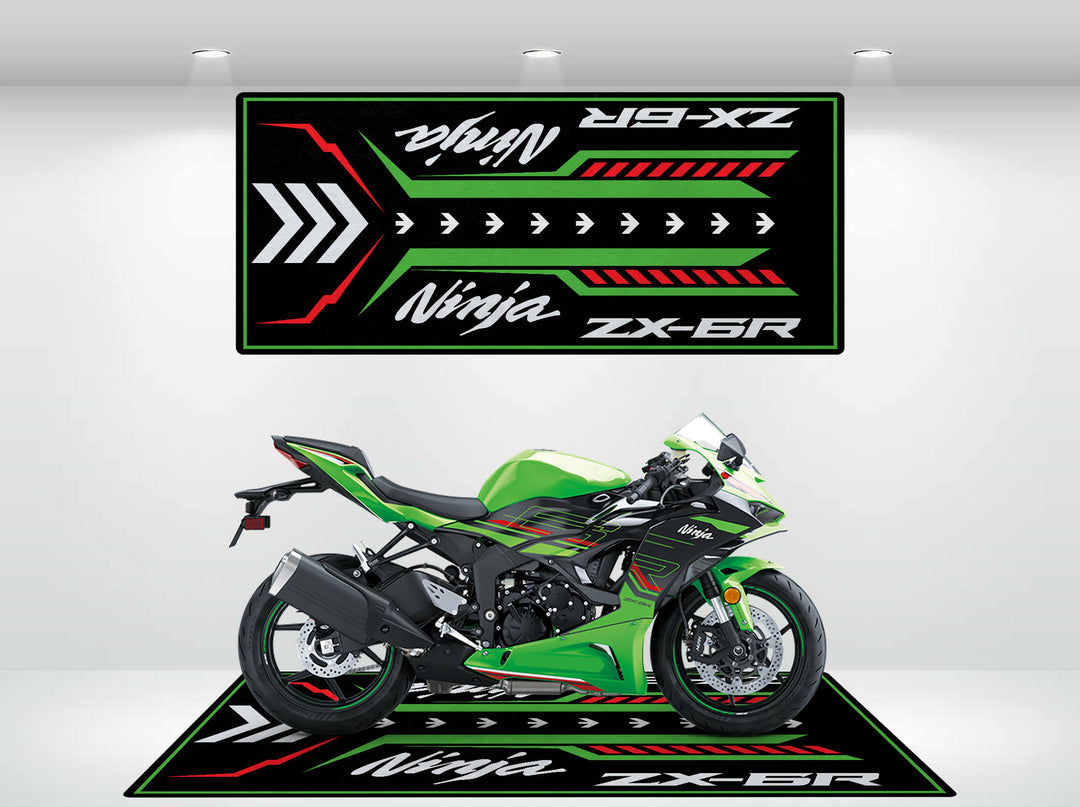 A Kawasaki ZX-6R is displayed on a green Motorcycle Pit Mat, featuring bold black, red, and white designs with the Ninja ZX-6R text in stylized fonts, enhancing the visual appeal.