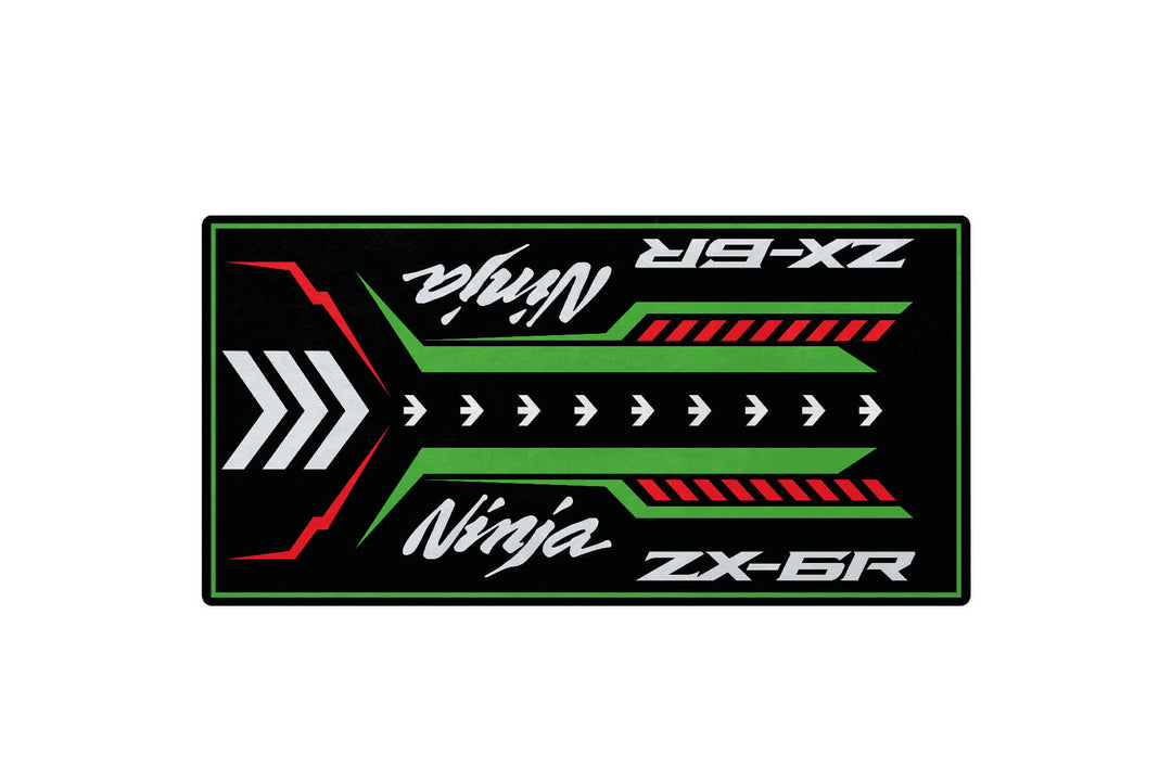 The Motorcycle Pit Mat for Kawasaki ZX-6R features stylized Ninja and ZX-6R graphics in white, with green, red, and white arrows on a black background in a symmetrical layout.