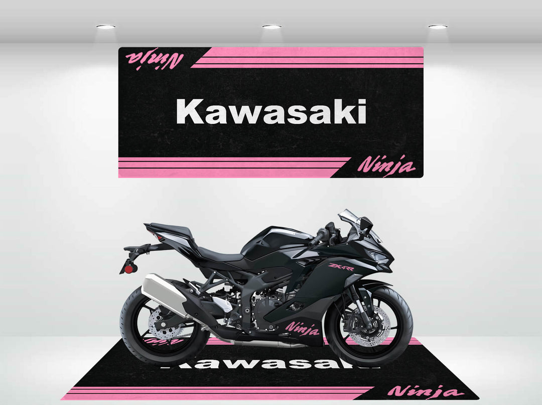 A sleek black Kawasaki Ninja motorcycle is showcased in a showroom on a Motorcycle Pit Mat X SMALL VROOM Kawasaki Ninja Mat. The cohesive branding comes alive under bright lights, complementing the display with its pink and black design.