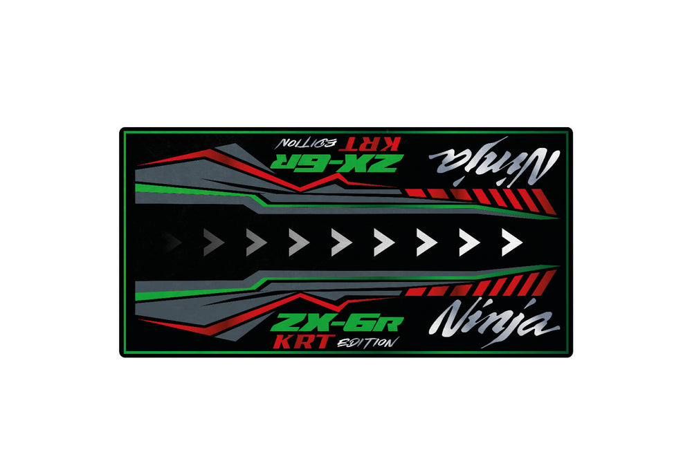 A digital graphic shows colorful geometric patterns with the text Motorcycle Mat for Kawasaki ZX-6R KRT Edition in green, red, and white on a black background. The design mirrors the sleek aesthetic of a Motorcycle Pit Mat, capturing the dynamic vibe of motorcycle culture.