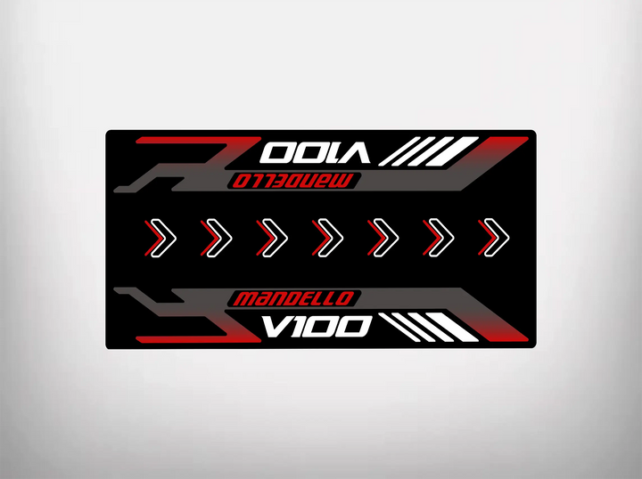 The Motorcycle Pit Mat for Mandello V100 Special is a rectangular graphic with a black background, featuring Mandello V100 in bold red and white letters. White arrows suggest motion like a motorbike mat design and red and white lines on the edges echo motorcycle floor mat style.