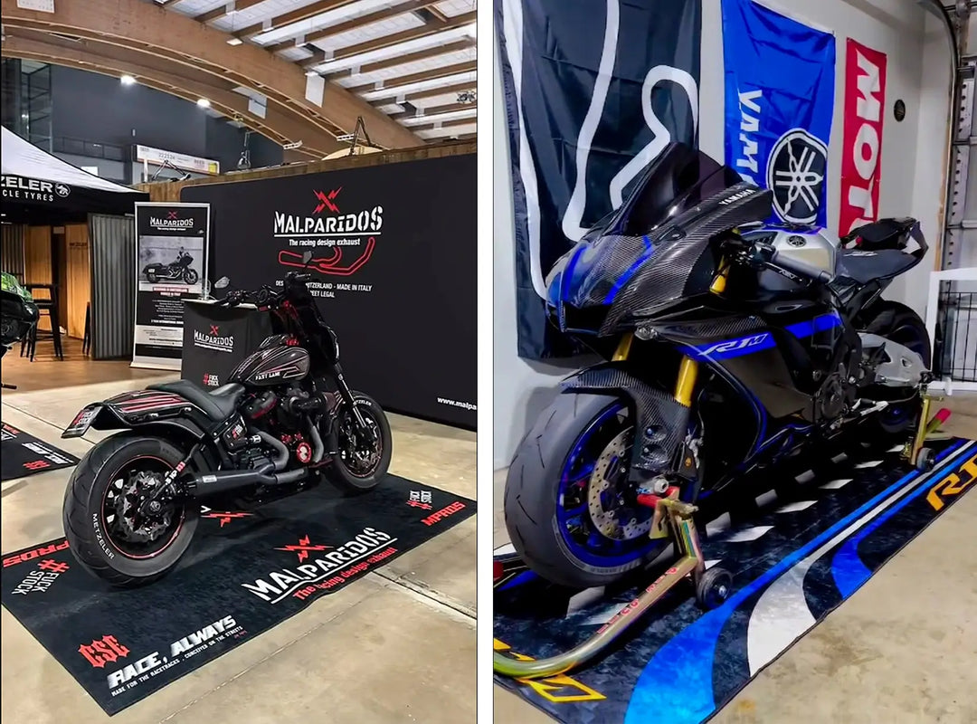 Two motorcycles are showcased indoors, each elegantly placed on a Motorcycle Pit Mats Custom Motorcycle Garage Pit Mat. The left one shines in black with red accents, while the right stands out in blue and black. Banners and signage complete the backdrop, enhancing the showroom ambiance.