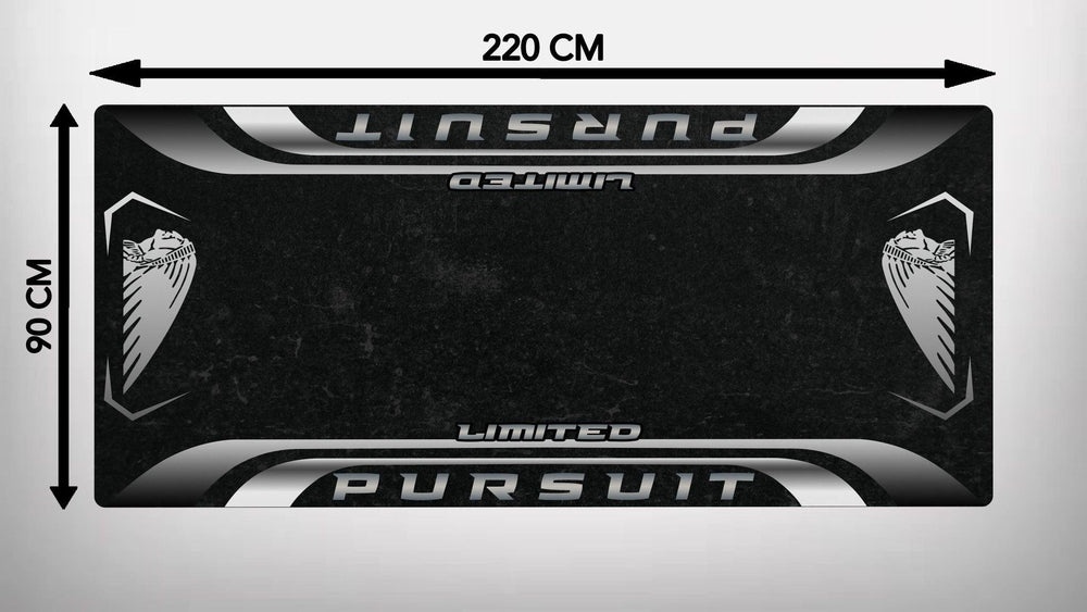 The Motorcycle Pit Mat for Indian Pursuit Limited is a black rectangular gaming mat, adorned with Pursuit Limited in white and silver and stylized hawks at each corner. Measuring 220 cm by 90 cm, it doubles as a sleek motorcycle garage mat for style-conscious users.