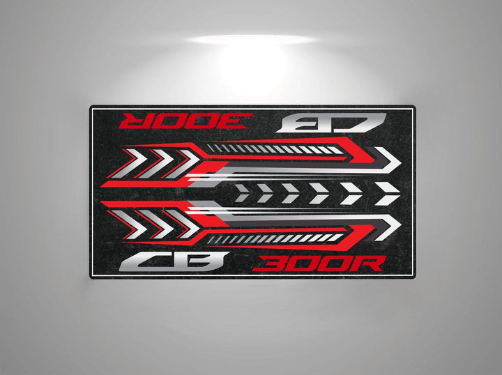 A bold digital graphic of red and white arrows with geometric shapes on a dark backdrop reflects the sleek design of the Motorcycle Pit Mat for Honda CB300R. The stylized text CB 300R and EDGE captures the dynamic essence of a motorcycle garage mat or vehicle emblem.