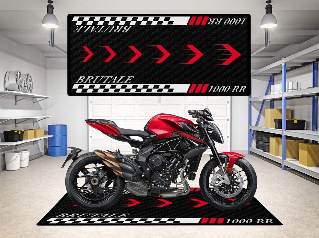 A red motorcycle is parked indoors on a checkered Motorcycle Pit Mat with red and white arrow designs. The room has shelves and a tire on the wall. A vertical Motorcycle Mat for MV Agusta Brutale 1000RR matches the setup.
.