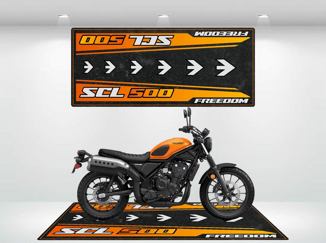 In a showroom, a black and orange motorcycle rests on a matching Motorcycle Pit Mat designed for the Honda SCL500. The mats SCL 500 Freedom logo is mirrored by another rug on the wall, while overhead spotlights illuminate this unique setup.