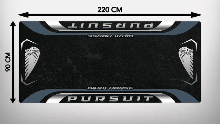 The Motorcycle Pit Mat for the Indian Pursuit Dark Horse is a rectangular black mat featuring silver PURSUIT and DARK HORSE text, with a stylized horse head graphic on each side. It resembles a motorcycle floor mat and measures 220 cm by 90 cm.