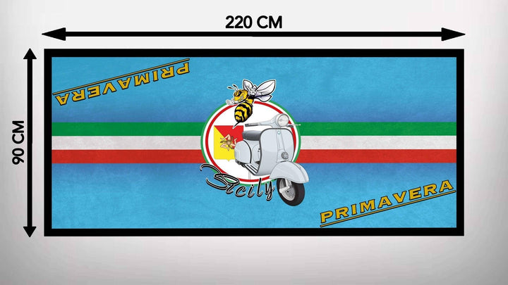 The Motorcycle Pit Mat for Vespa Primavera is a 220x90 cm rectangular mat with a blue base, featuring a Vespa scooter, bee, Sicilian emblem, and Italian flag colors. The words Sicily and Primavera are included in the design.