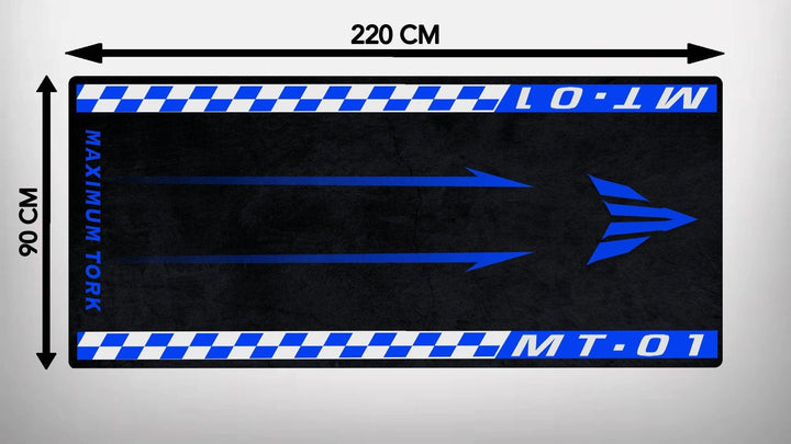 Rectangular Motorcycle Pit Mat for Yamaha MT-01 with Maximum Tork on the side, featuring blue and white checkered borders and a central blue right-pointing arrow; dimensions are 220 cm x 90 cm, adding style to your garage floor.