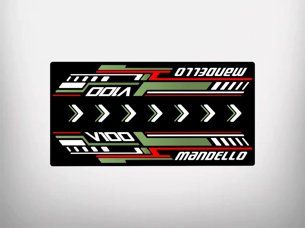 The Motorcycle Pit Mat brands Motorcycle Mat for Mandello V100 features a stylized, symmetrical design with V100, Mandello, and green, white, red diagonal stripes and arrows on a black background.