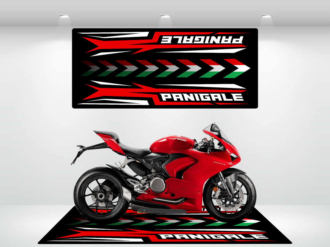 A red sport motorcycle sits on a striking black, red, and white Motorcycle Pit Mat for Panigale. Above it, a matching banner with dynamic arrows features the same text. The scene is brightly lit.