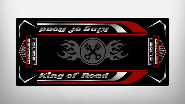 The Motorcycle Pit Mats King of Road - Glide Beyond Limits design features a black bandana with red, white, and gray stripes, showcasing phrases like King of Road and Beyond Limits. The central graphic includes two crossed pistons with flames, making it an ideal accessory for any motorcycle garage.