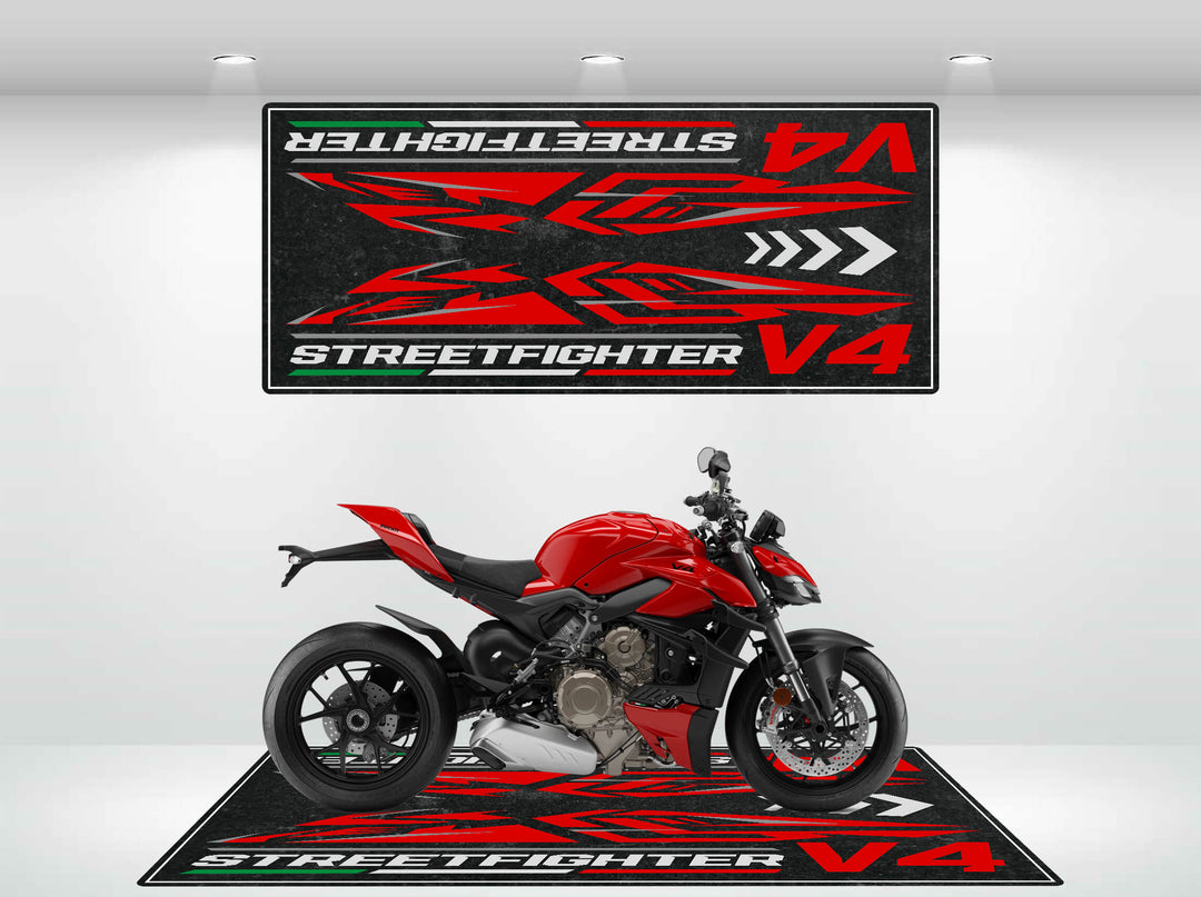 A bright red motorcycle rests on a sleek Motorcycle Pit Mat featuring Street Fighter V4 in bold red and white. Above it, a matching wall decoration echoes the same text and vibrant red patterns for a cohesive look.