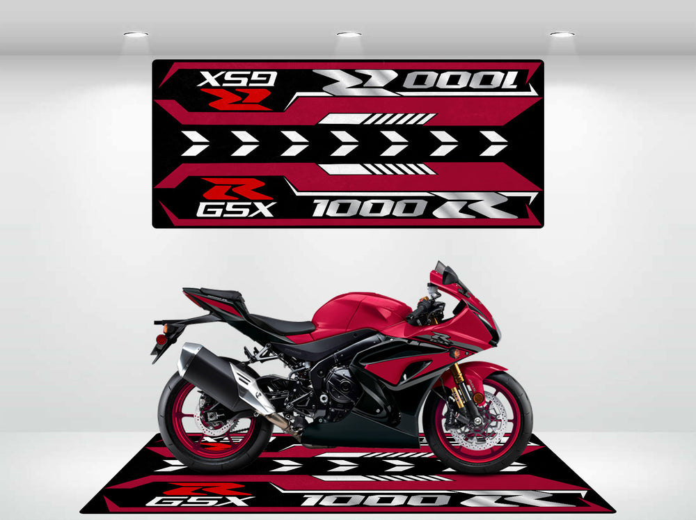 A sleek Suzuki GSX-R1000R 2025 motorcycle shines on a matching themed platform with a Motorcycle Pit Mat. The striking red, white, and black scheme featuring GSX-R and 1000 is enhanced under the showroom lights.