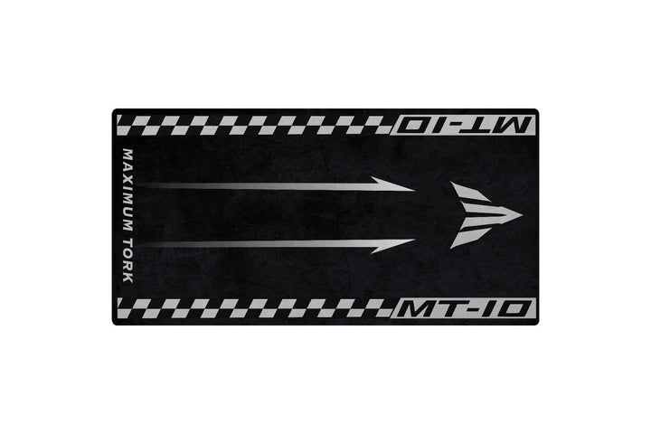 The Motorcycle Pit Mat for Yamaha MT-10 is a black and gray mat featuring a road theme with two white arrows, MAXIMUM TORQUE on the left, MT-10 on top and bottom edges, and checkered side borders.