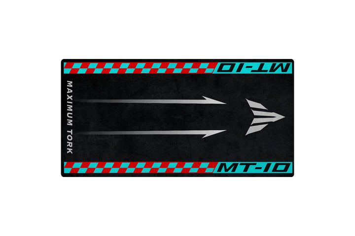 The Motorcycle Pit Mat for Yamaha MT-10 is a black rectangular garage mat with blue and red borders, showcasing the text MT-10 and MAXIMUM TORK, complemented by three arrows and a triangle on a textured surface.