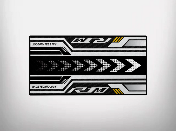 The Motorcycle Pit Mat for Yamaha R1M 2025 is a rectangular mouse pad with a racing theme, featuring white and gray arrows on black, yellow accents, and RACE TECHNOLOGY and RM in stylized fonts. Its eco-friendly, protecting both your desk and the environment.