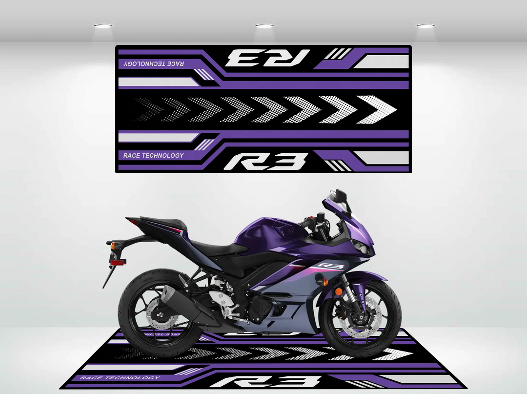 A purple and black sport motorcycle sits in a showroom, enhanced by a Yamaha R3 2025 Motorcycle Mat from Motorcycle Pit Mat. Bold graphics with arrows, the R3, and Race Technology text in purple and black on a white background complete the scene.