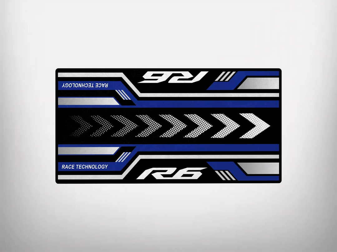 The Motorcycle Pit Mats rectangular design features a racing theme with blue, white, and black stripes and arrow patterns. Race Technology and R6 text emphasize speed and motion, ideal for enhancing your garage floor or as a Yamaha R6 mat.